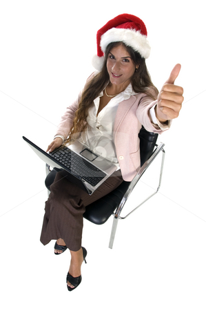 To use this stock image in your creative project, please select the size you need over to the right and click the "Add to Cart" button.
Your downloaded image will come with the Cutcaster watermark removed so don’t worry about the watermark you see on this page. Businesswoman wishing good luck stock photo, Businesswoman wishing good luck smiling lady with santacap by Imagery Majestic