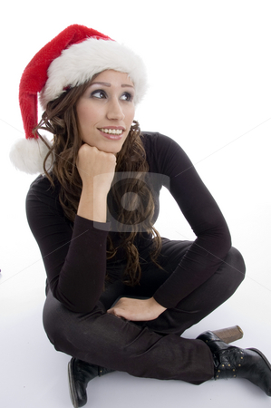 To use this stock image in your creative project, please select the size you need over to the right and click the "Add to Cart" button.
Your downloaded image will come with the Cutcaster watermark removed so don’t worry about the watermark you see on this page. Sitting woman wearing christmas hat stock photo, Sitting woman wearing christmas hat on an isolated background by Imagery Majestic
