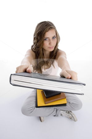 To use this stock image in your creative project, please select the size you need over to the right and click the "Add to Cart" button.
Your downloaded image will come with the Cutcaster watermark removed so don’t worry about the watermark you see on this page. Sitting girl showing book stock photo, Sitting girl showing book against white background by Imagery Majestic