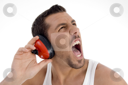To use this stock image in your creative project, please select the size you need over to the right and click the "Add to Cart" button.
Your downloaded image will come with the Cutcaster watermark removed so don’t worry about the watermark you see on this page. Young guy enjoying rock music with full volume stock photo, Young guy enjoying rock music with full volume against white background by Imagery Majestic