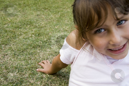 To use this stock image in your creative project, please select the size you need over to the right and click the "Add to Cart" button.
Your downloaded image will come with the Cutcaster watermark removed so don’t worry about the watermark you see on this page. Smiling little girl sitting on grass stock photo, Close view of smiling little girl sitting on grass by Imagery Majestic