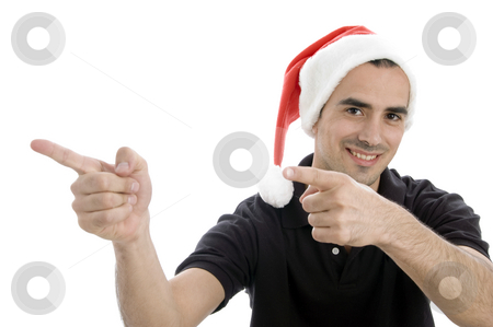 To use this stock image in your creative project, please select the size you need over to the right and click the "Add to Cart" button.
Your downloaded image will come with the Cutcaster watermark removed so don’t worry about the watermark you see on this page. Pointing man with christmas hat stock photo, Pointing man with christmas hat with white background by Imagery Majestic