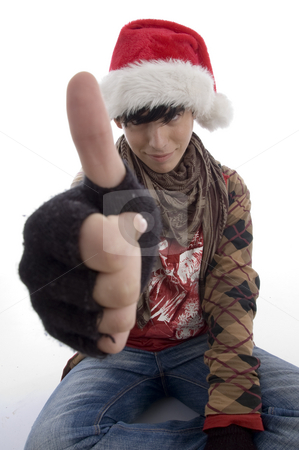 To use this stock image in your creative project, please select the size you need over to the right and click the "Add to Cart" button.
Your downloaded image will come with the Cutcaster watermark removed so don’t worry about the watermark you see on this page. Young boy wearing christmas hat showing thumb stock photo, Young boy wearing christmas hat showing thumb on an isolated white background by Imagery Majestic
