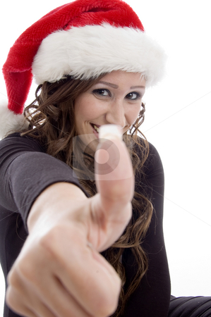 To use this stock image in your creative project, please select the size you need over to the right and click the "Add to Cart" button.
Your downloaded image will come with the Cutcaster watermark removed so don’t worry about the watermark you see on this page. Woman wearing christmas hat showing you good luck sign stock photo, Woman wearing christmas hat showing you good luck sign on an isolated background by Imagery Majestic