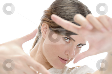 To use this stock image in your creative project, please select the size you need over to the right and click the "Add to Cart" button.
Your downloaded image will come with the Cutcaster watermark removed so don’t worry about the watermark you see on this page. Woman showing framing hand gesture stock photo, Woman showing framing hand gesture on an isolated background by Imagery Majestic