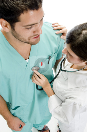 To use this stock image in your creative project, please select the size you need over to the right and click the "Add to Cart" button.
Your downloaded image will come with the Cutcaster watermark removed so don’t worry about the watermark you see on this page. Nurse examining the patient with stethoscope stock photo, Nurse examining the patient with stethoscope with white background by Imagery Majestic