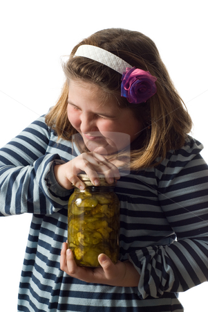 To use this stock image in your creative project, please select the size you need over to the right and click the "Add to Cart" button.
Your downloaded image will come with the Cutcaster watermark removed so don’t worry about the watermark you see on this page. Persistence Concept stock photo, Concept image of a young girl trying to open a jar of canned pickles, isolated against a white background by Richard Nelson