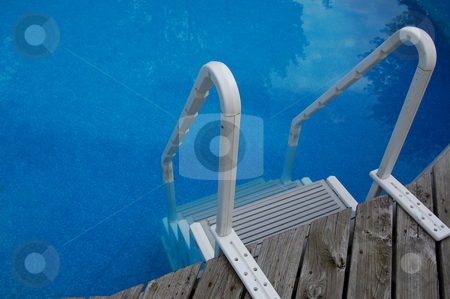 To use this stock image in your creative project, please select the size you need over to the right and click the "Add to Cart" button.
Your downloaded image will come with the Cutcaster watermark removed so don’t worry about the watermark you see on this page. Pool Ladder stock photo, A pool ladder by Crystal Srock