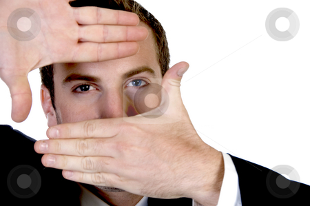 To use this stock image in your creative project, please select the size you need over to the right and click the "Add to Cart" button.
Your downloaded image will come with the Cutcaster watermark removed so don’t worry about the watermark you see on this page. Young businessman making a finger frame in front of his eyes stock photo, Young businessman making a finger frame in front of his eyes with white background by Imagery Majestic