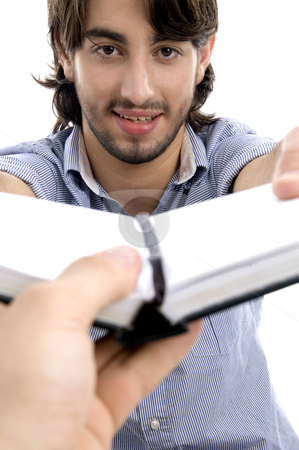 To use this stock image in your creative project, please select the size you need over to the right and click the "Add to Cart" button.
Your downloaded image will come with the Cutcaster watermark removed so don’t worry about the watermark you see on this page. Handsome man showing his diary stock photo, Handsome man showing his diary against white background by Imagery Majestic