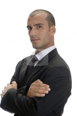 To use this stock image in your creative project, please select the size you need over to the right and click the "Add to Cart" button.
Your downloaded image will come with the Cutcaster watermark removed so don’t worry about the watermark you see on this page. Handsome businessman posing stock photo, Handsome businessman posing with arms crossed and looking to camera by Imagery Majestic