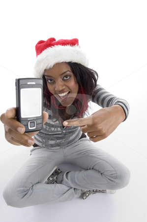 To use this stock image in your creative project, please select the size you need over to the right and click the "Add to Cart" button.
Your downloaded image will come with the Cutcaster watermark removed so don’t worry about the watermark you see on this page. Sitting girl indicating cell phone stock photo, Sitting girl indicating cell phone on an isolated background by Imagery Majestic