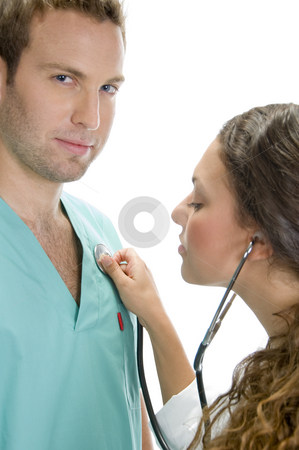 To use this stock image in your creative project, please select the size you need over to the right and click the "Add to Cart" button.
Your downloaded image will come with the Cutcaster watermark removed so don’t worry about the watermark you see on this page. Doctor examining the patient with stethoscope stock photo, Doctor examining the patient with stethoscope by Imagery Majestic