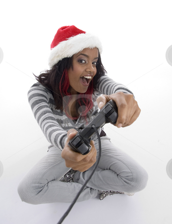 To use this stock image in your creative project, please select the size you need over to the right and click the "Add to Cart" button.
Your downloaded image will come with the Cutcaster watermark removed so don’t worry about the watermark you see on this page. Young girl showing remote stock photo, Young girl showing remote with white background by Imagery Majestic