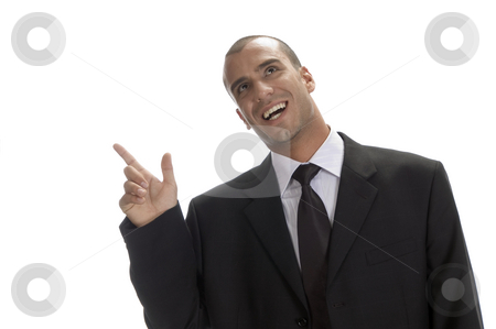 To use this stock image in your creative project, please select the size you need over to the right and click the "Add to Cart" button.
Your downloaded image will come with the Cutcaster watermark removed so don’t worry about the watermark you see on this page. Happy businessman pointing stock photo, Happy businessman pointing to back side by Imagery Majestic