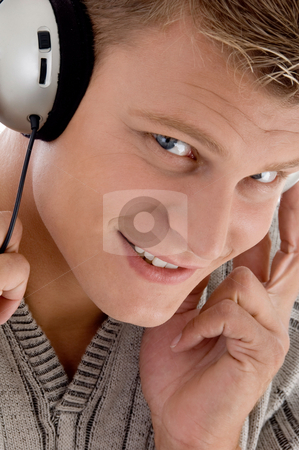To use this stock image in your creative project, please select the size you need over to the right and click the "Add to Cart" button.
Your downloaded image will come with the Cutcaster watermark removed so don’t worry about the watermark you see on this page. Smiling man with headphone stock photo, Smiling man with headphone on an isolated background by Imagery Majestic
