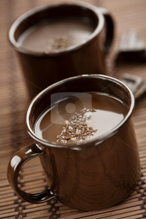 To use this stock image in your creative project, please select the size you need over to the right and click the "Add to Cart" button.
Your downloaded image will come with the Cutcaster watermark removed so don’t worry about the watermark you see on this page. Hot chocolate stock photo, Hot chocolate with chocolate shaings by Liv Friis-Larsen
