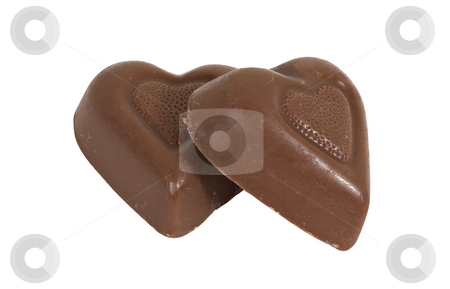To use this stock image in your creative project, please select the size you need over to the right and click the "Add to Cart" button.
Your downloaded image will come with the Cutcaster watermark removed so don’t worry about the watermark you see on this page. Two Chocolate Candy Hearts stock photo, Two chocolate candy hearts isolated over a white background by Stephen Bonk