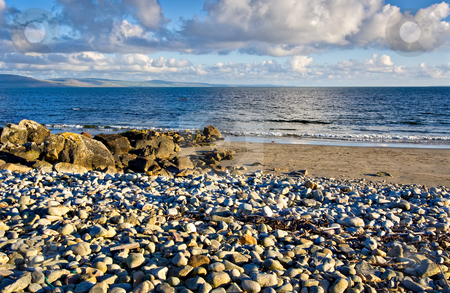To use this stock image in your creative project, please select the size you need over to the right and click the "Add to Cart" button.
Your downloaded image will come with the Cutcaster watermark removed so don’t worry about the watermark you see on this page. Galway Bay stock photo, Galway Bay in Ireland with The Burren in the background by Stephen Bonk