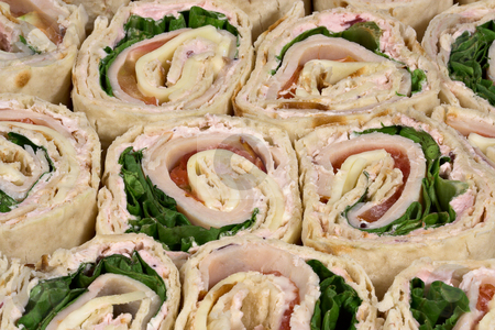To use this stock image in your creative project, please select the size you need over to the right and click the "Add to Cart" button.
Your downloaded image will come with the Cutcaster watermark removed so don’t worry about the watermark you see on this page. Turkey warp sandwiches stock photo, Several sliced turkey wrap sandwiches by Stephen Bonk