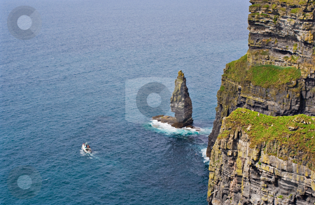 To use this stock image in your creative project, please select the size you need over to the right and click the "Add to Cart" button.
Your downloaded image will come with the Cutcaster watermark removed so don’t worry about the watermark you see on this page. Cliffs of Moher and Boat stock photo, The Cliffs of Moher in Ireland with a boat in the Atlantic Ocean by Stephen Bonk