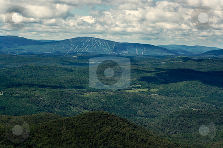 To use this stock image in your creative project, please select the size you need over to the right and click the "Add to Cart" button.
Your downloaded image will come with the Cutcaster watermark removed so don’t worry about the watermark you see on this page. Mountains and Ski Slopes in the Summer stock photo, View of mountains and ski slopes on a summer day. View is from the top of a high mountain in the Green Mountains of Vermont. by Stephen Bonk