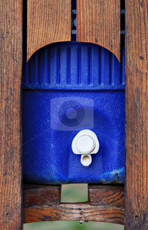 To use this stock image in your creative project, please select the size you need over to the right and click the "Add to Cart" button.
Your downloaded image will come with the Cutcaster watermark removed so don’t worry about the watermark you see on this page. Water Thermos stock photo, A large water cooler or thermos in a wood casing by Stephen Bonk