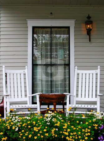 To use this stock image in your creative project, please select the size you need over to the right and click the "Add to Cart" button.
Your downloaded image will come with the Cutcaster watermark removed so don’t worry about the watermark you see on this page. Porch and Chairs stock photo, A porch with two chairs and a flower bed by Stephen Bonk