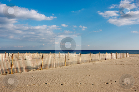 To use this stock image in your creative project, please select the size you need over to the right and click the "Add to Cart" button.
Your downloaded image will come with the Cutcaster watermark removed so don’t worry about the watermark you see on this page. Fence on the Beach stock photo, A wooden fence on the beach, The fence is on the sand in the foreground with the ocean and sky above. by Stephen Bonk