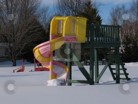 To use this stock image in your creative project, please select the size you need over to the right and click the "Add to Cart" button.
Your downloaded image will come with the Cutcaster watermark removed so don’t worry about the watermark you see on this page. A Winter Slide stock photo, A slide in a playground at the height of winter. by Ray Carpenter