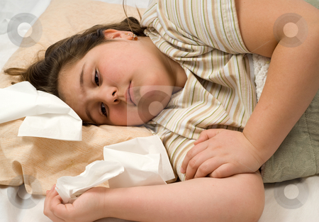 To use this stock image in your creative project, please select the size you need over to the right and click the "Add to Cart" button.
Your downloaded image will come with the Cutcaster watermark removed so don’t worry about the watermark you see on this page. Sick Child stock photo, A young girl not feeling well is lying in bed with tissues around her by Richard Nelson