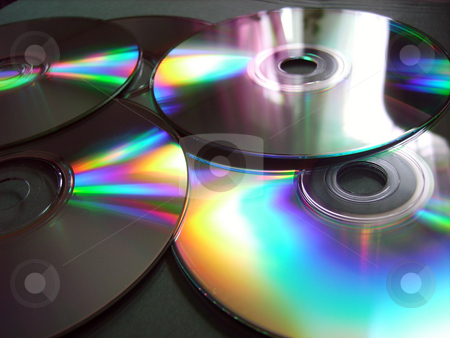 To use this stock image in your creative project, please select the size you need over to the right and click the "Add to Cart" button.
Your downloaded image will come with the Cutcaster watermark removed so don’t worry about the watermark you see on this page. Compact Disks stock photo, Close-up of compact disks with reflections of color by Tudor Antonel adrian
