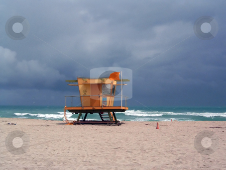 To use this stock image in your creative project, please select the size you need over to the right and click the "Add to Cart" button.
Your downloaded image will come with the Cutcaster watermark removed so don’t worry about the watermark you see on this page. Stormy Lifeguard Tower stock photo, A stormy beach day in Miami, Florida. by Todd Arena