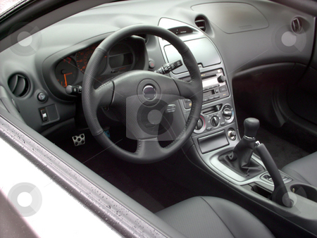 To use this stock image in your creative project, please select the size you need over to the right and click the "Add to Cart" button.
Your downloaded image will come with the Cutcaster watermark removed so don’t worry about the watermark you see on this page. Car Interior stock photo, An interior of a brand new sports car. by Todd Arena