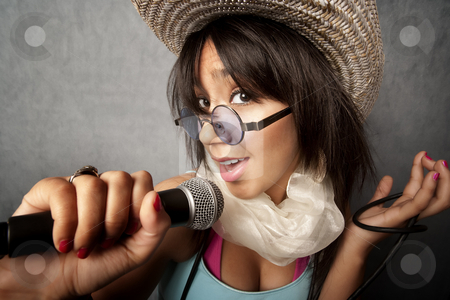 To use this stock image in your creative project, please select the size you need over to the right and click the "Add to Cart" button.
Your downloaded image will come with the Cutcaster watermark removed so don’t worry about the watermark you see on this page. Beautiful Young Singer stock photo, Pretty young singer with a large microphone by Scott Griessel