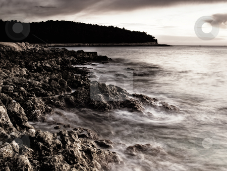 To use this stock image in your creative project, please select the size you need over to the right and click the "Add to Cart" button.
Your downloaded image will come with the Cutcaster watermark removed so don’t worry about the watermark you see on this page. Adriatic sunset stock photo, Sunset on the beach.Rocky adriatic coast on the island Losinj, Croatia. by Sinisa Botas
