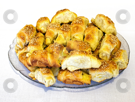 To use this stock image in your creative project, please select the size you need over to the right and click the "Add to Cart" button.
Your downloaded image will come with the Cutcaster watermark removed so don’t worry about the watermark you see on this page. Croissants stock photo, Lot of salty croissants with cheese and sesame. by Sinisa Botas