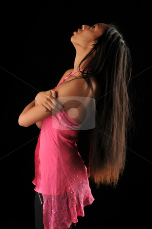 To use this stock image in your creative project, please select the size you need over to the right and click the "Add to Cart" button.
Your downloaded image will come with the Cutcaster watermark removed so don’t worry about the watermark you see on this page. Long hair stock photo, Long haired, dark skinned beauty against a black background by Harris Shiffman