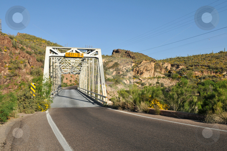 To use this stock image in your creative project, please select the size you need over to the right and click the "Add to Cart" button.
Your downloaded image will come with the Cutcaster watermark removed so don’t worry about the watermark you see on this page. Trestle stock photo, Single lane trestle bridge on Apache Trail, Canyon Lake, northeast of Phoenix, Arizona by Harris Shiffman