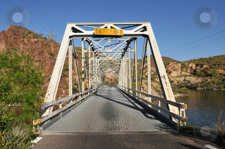 To use this stock image in your creative project, please select the size you need over to the right and click the "Add to Cart" button.
Your downloaded image will come with the Cutcaster watermark removed so don’t worry about the watermark you see on this page. Trestle stock photo, Single lane trestle bridge on Apache Trail, Canyon Lake, northeast of Phoenix, Arizona by Harris Shiffman