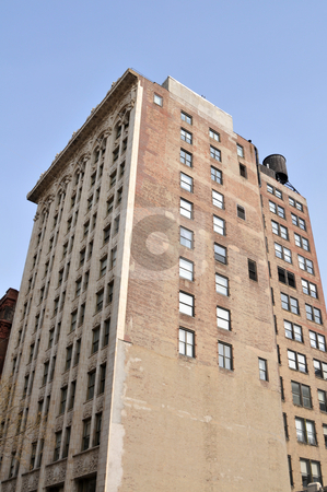To use this stock image in your creative project, please select the size you need over to the right and click the "Add to Cart" button.
Your downloaded image will come with the Cutcaster watermark removed so don’t worry about the watermark you see on this page. Office building stock photo, Old brick office building, midtown Manhattan, New York, New York by Harris Shiffman