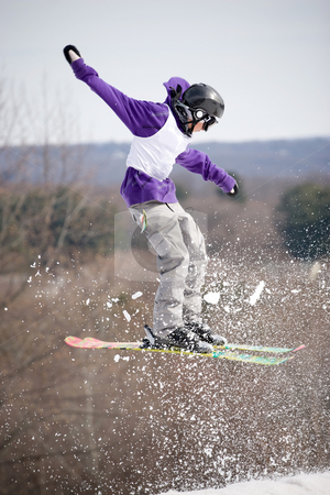 To use this stock image in your creative project, please select the size you need over to the right and click the "Add to Cart" button.
Your downloaded image will come with the Cutcaster watermark removed so don’t worry about the watermark you see on this page. Ski Jumper stock photo, A skier catching some major air after launching off of a jump. by Todd Arena
