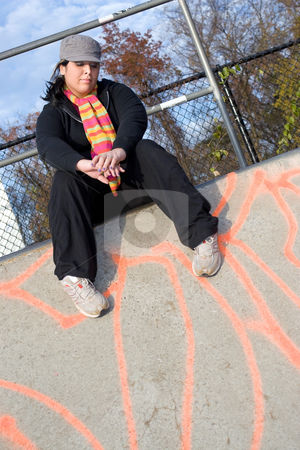 To use this stock image in your creative project, please select the size you need over to the right and click the "Add to Cart" button.
Your downloaded image will come with the Cutcaster watermark removed so don’t worry about the watermark you see on this page. Girl at the Skate Park stock photo, A young woman sitting at the top of a skate ramp. by Todd Arena