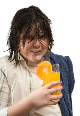 To use this stock image in your creative project, please select the size you need over to the right and click the "Add to Cart" button.
Your downloaded image will come with the Cutcaster watermark removed so don’t worry about the watermark you see on this page. Girl Drinking Orange Juice stock photo, Closeup view of a girl with wet hair holding a towel and a glass of fresh orange juice, isolated against a white background by Richard Nelson