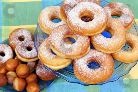 To use this stock image in your creative project, please select the size you need over to the right and click the "Add to Cart" button.
Your downloaded image will come with the Cutcaster watermark removed so don’t worry about the watermark you see on this page. Doughnut stock photo, Fresh and warm doughnuts as background by Jolanta Dabrowska