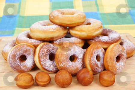 To use this stock image in your creative project, please select the size you need over to the right and click the "Add to Cart" button.
Your downloaded image will come with the Cutcaster watermark removed so don’t worry about the watermark you see on this page. Doughnut stock photo, Fresh and warm doughnuts as background by Jolanta Dabrowska