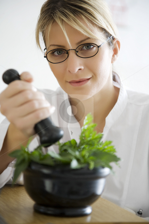 To use this stock image in your creative project, please select the size you need over to the right and click the "Add to Cart" button.
Your downloaded image will come with the Cutcaster watermark removed so don’t worry about the watermark you see on this page. Herbal medicine stock photo, Pharmacist mixing herbal remedies by Liv Friis-Larsen