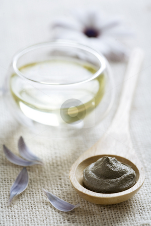 To use this stock image in your creative project, please select the size you need over to the right and click the "Add to Cart" button.
Your downloaded image will come with the Cutcaster watermark removed so don’t worry about the watermark you see on this page. Wellness products stock photo, Wooden spoon with mud (or clay) and glass bowl with oil by Liv Friis-Larsen