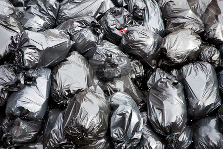 To use this stock image in your creative project, please select the size you need over to the right and click the "Add to Cart" button.
Your downloaded image will come with the Cutcaster watermark removed so don’t worry about the watermark you see on this page. Garbage bags stock photo, A pile of black garbage bags with tons of trash by Paul Hakimata