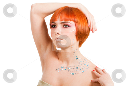 To use this stock image in your creative project, please select the size you need over to the right and click the "Add to Cart" button.
Your downloaded image will come with the Cutcaster watermark removed so don’t worry about the watermark you see on this page. Redhead with rhinestones stock photo, Beautiful redhead Caucasian girl with rhinestones and arm around her head and hand on shoulder, isolated by Paul Hakimata